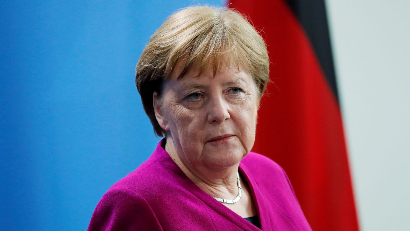 German Chancellor Merkel looks on as she attends a news conference at the Chancellery in Berlin