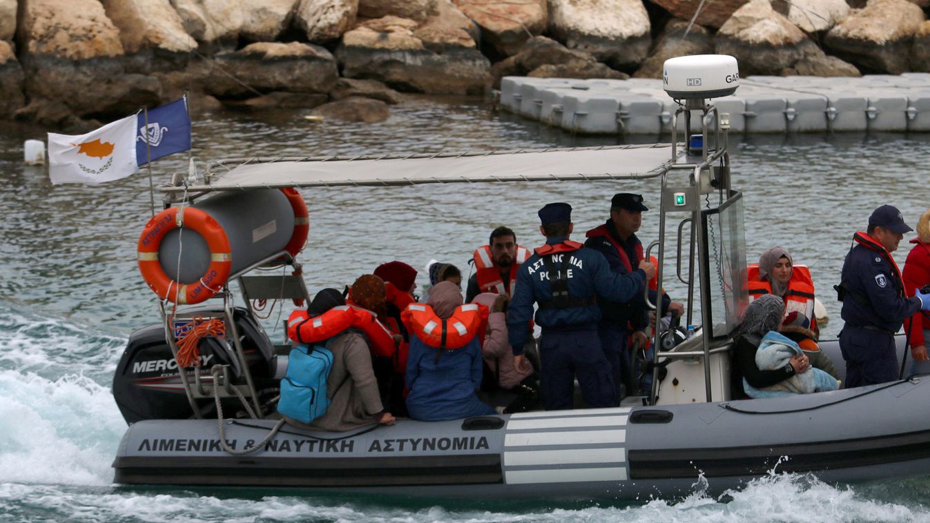 Syrian refugees are seen on a Cyprus coast guard boat off the south-east of the island in the region of Protaras