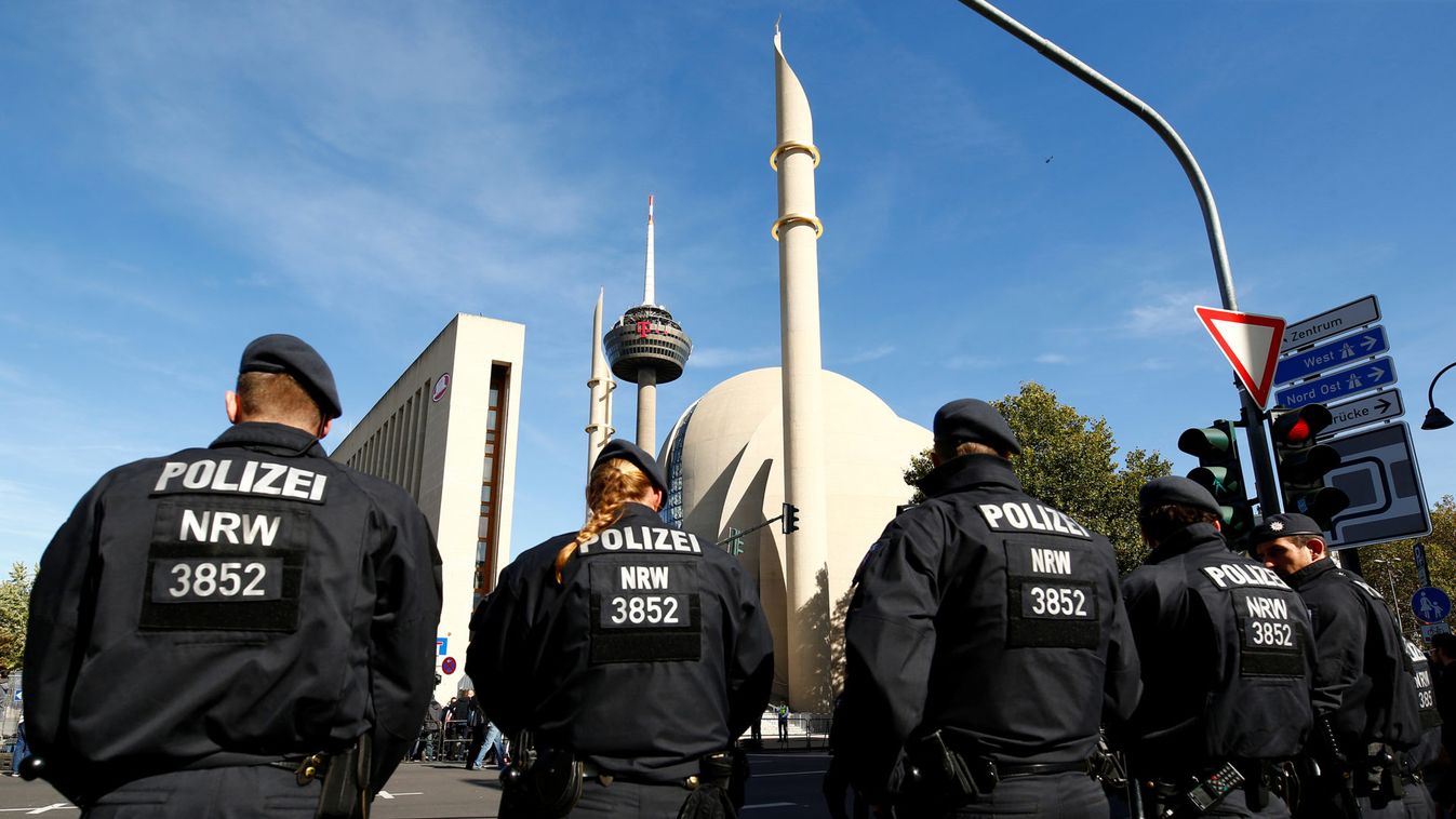 Police officers are seen in front the Cologne Central Mosque before it's official inauguration in Cologne