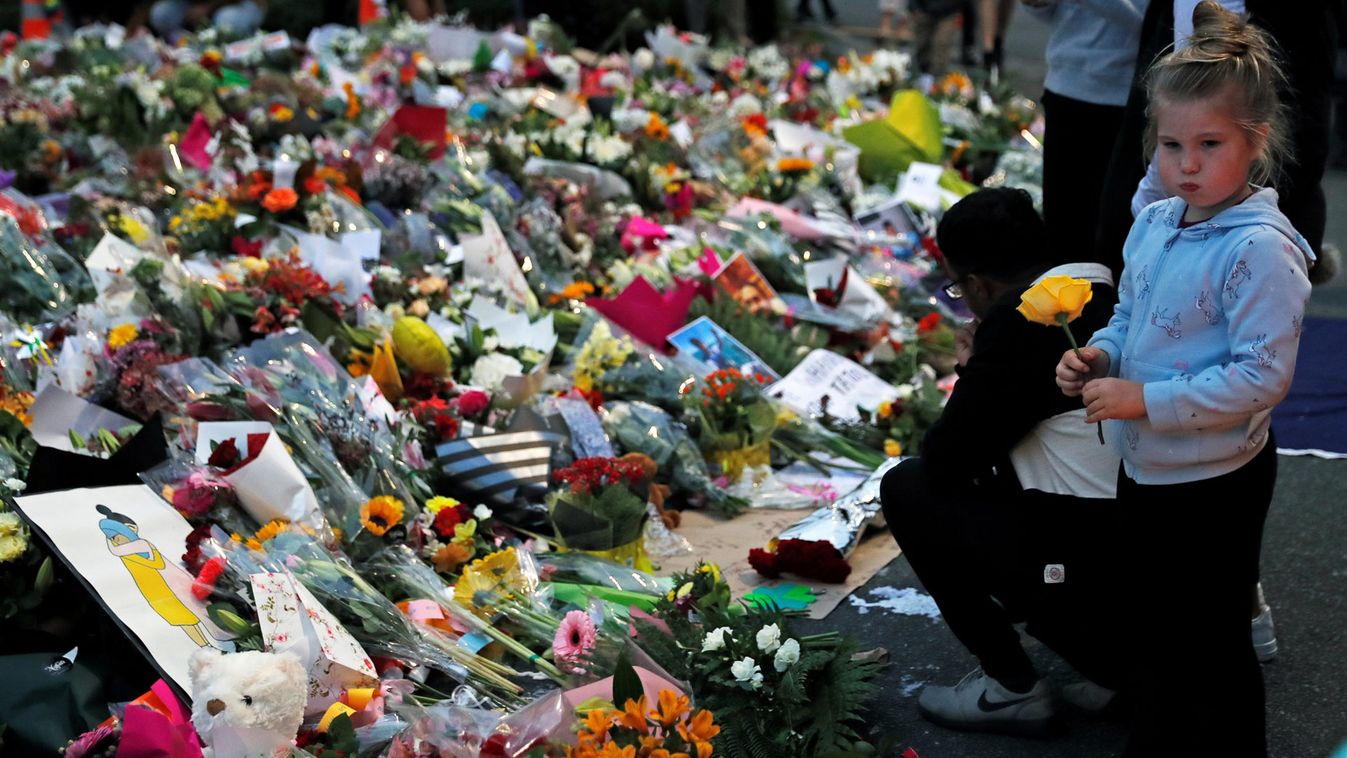 People visit a memorial site for victims of Friday's shooting, in front of the Masjid Al Noor mosque in Christchurch