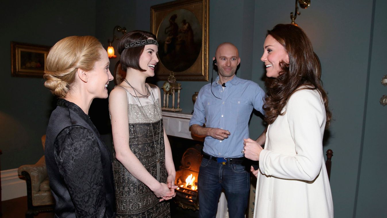 Britain's Catherine, Duchess of Cambridge, chats to actress Michelle Dockery and Joanne Froggatt during a visit to the set of Downton Abbey at Ealing Studios, west of London