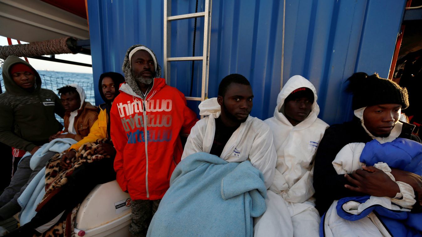 Rescued migrants rest on rescue ship 'Alan Kurdi' off coast of Malta