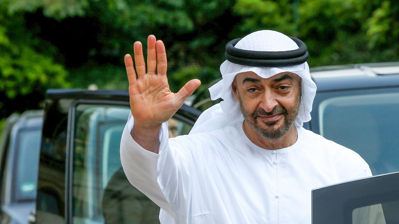 Abu Dhabi's Crown Prince Sheikh Mohammed bin Zayed al-Nahyan waves goodbye after a meeting about Qatar crisis at the Elysee Place in Paris