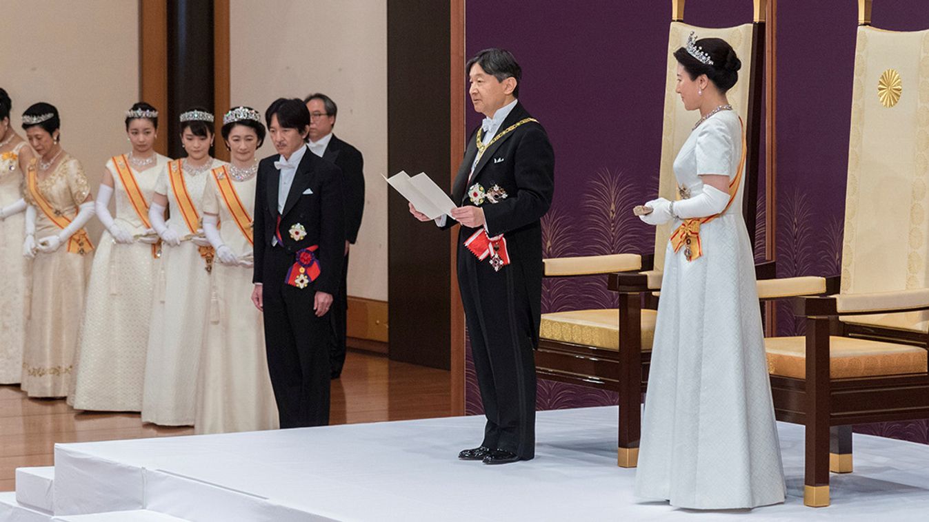 Japan's Emperor Naruhito, flanked by Empress Masako, delivers a speech during a ceremony called Sokui-go-Choken-no-gi, his first audience after the accession to the throne, at the Imperial Palace in Tokyo