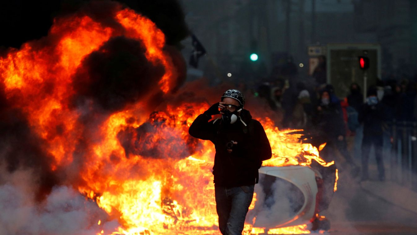 A car burns during clashes with police at a demonstration of the "yellow vests" movement in Marseille