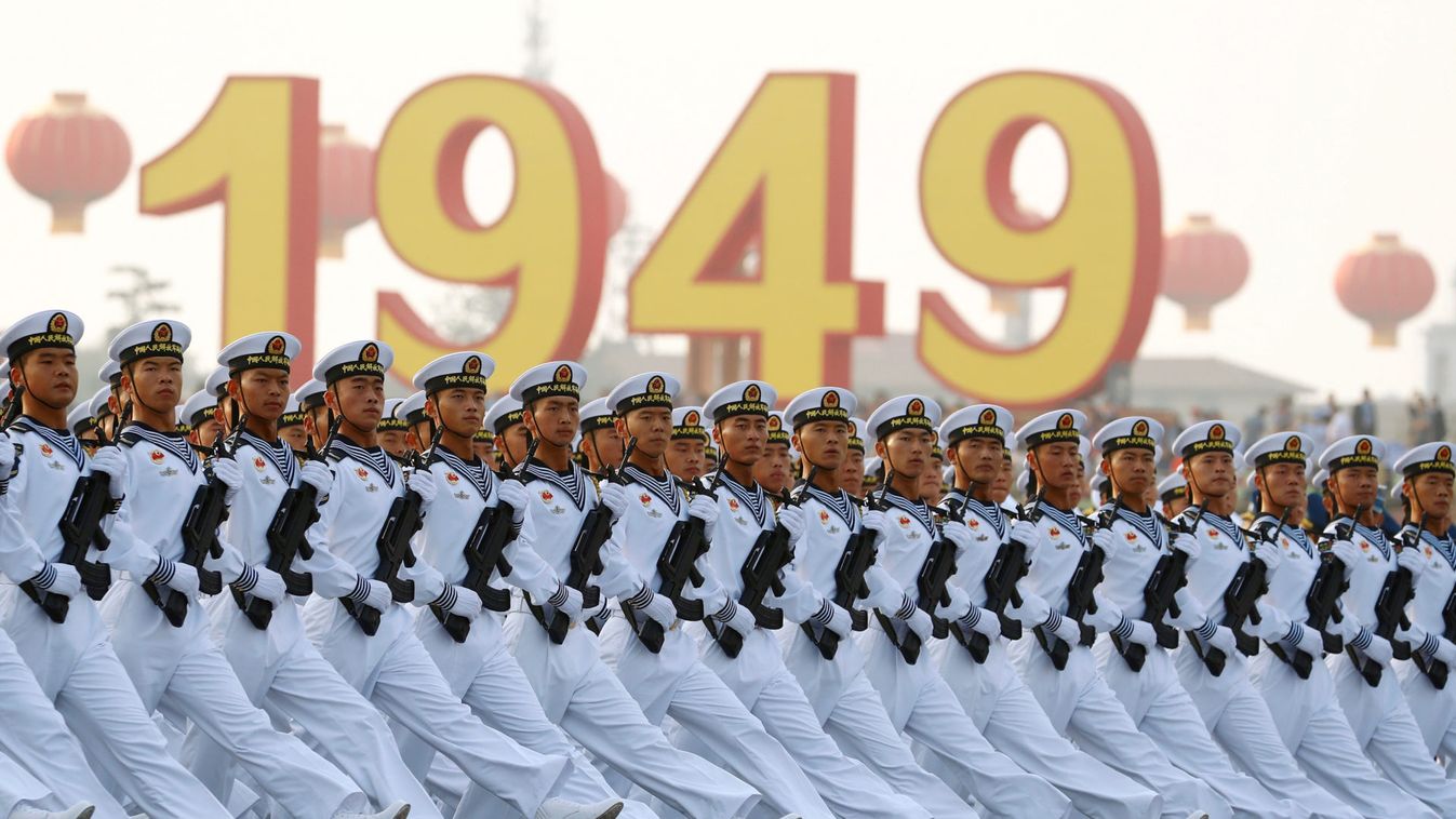 Soldiers of People's Liberation Army (PLA) march in formation past Tiananmen Square during a rehearsal before a military parade marking the 70th founding anniversary of People's Republic of China