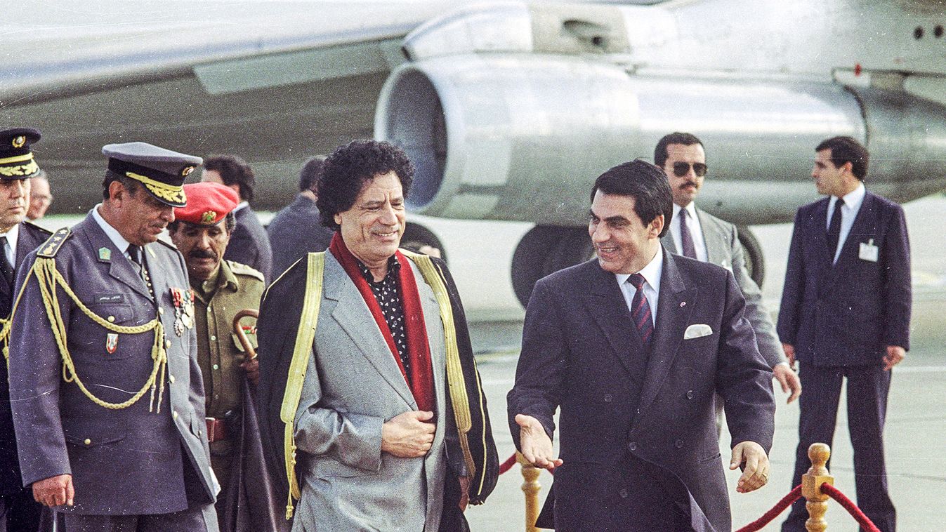 Tunisian President Zine Al-Abdine Ben Ali welcomes Libyan leader Muammar Gaddafi upon his arrival at Tunis airport