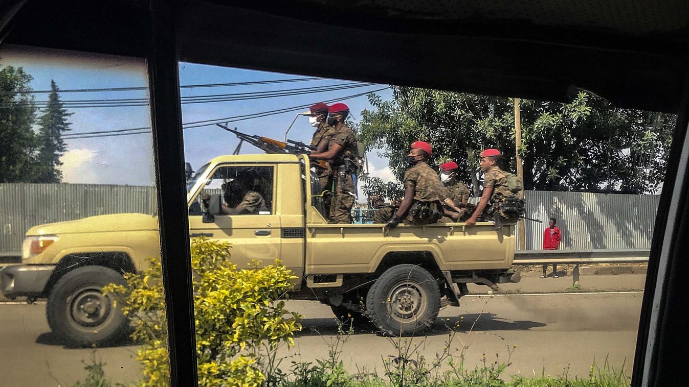 Ethiopian military ride on their pick-up truck as they patrol the streets following protests in Addis Ababa