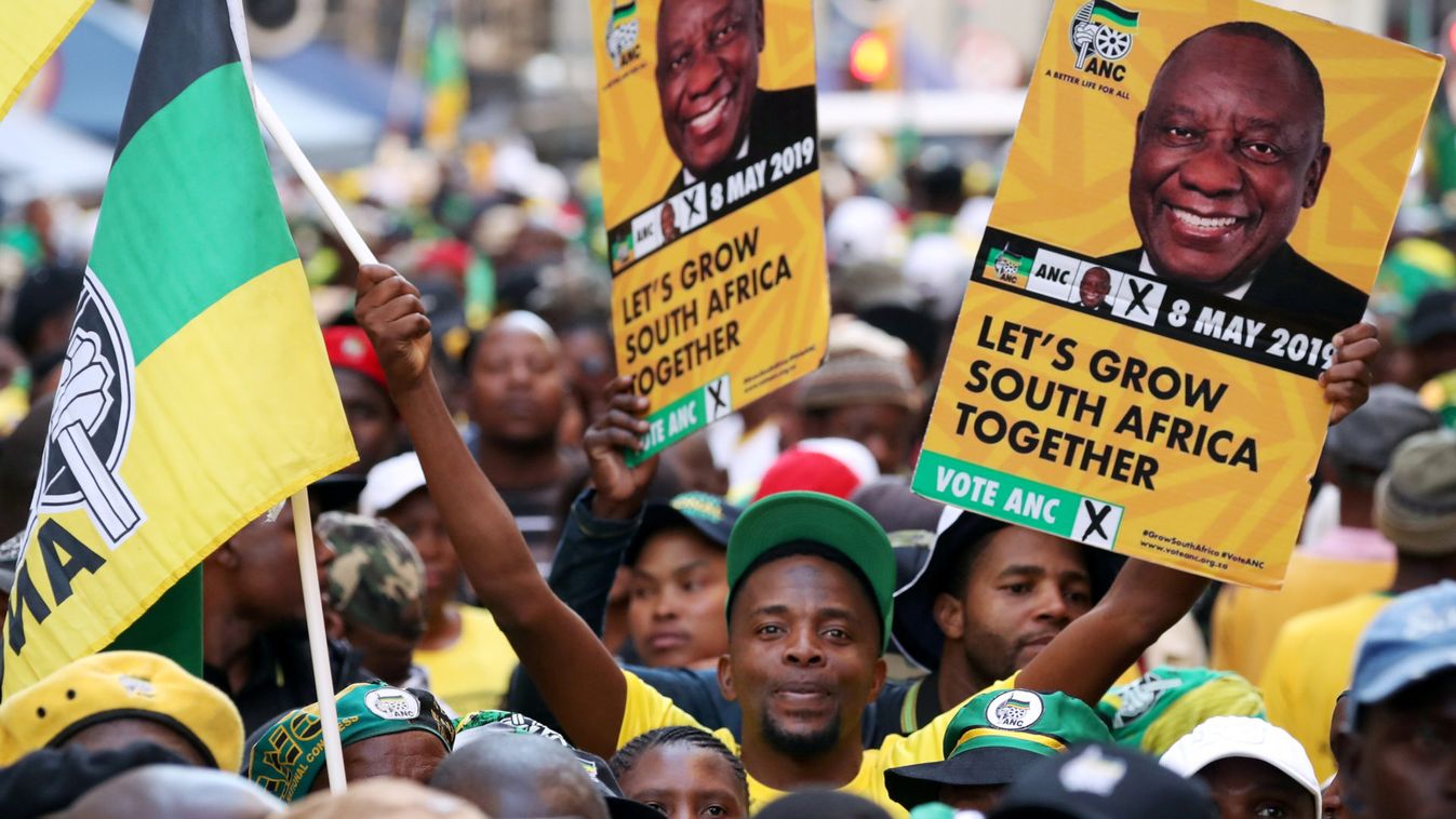 Supporters of President Cyril Ramaphosa's ruling African National Congress (ANC) celebrate election results at a rally in Johannesburg