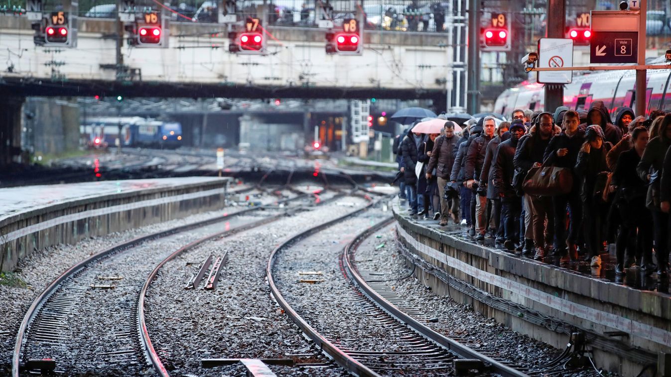 Commuters walk on a platform at Gare Saint-Lazare train station in Paris