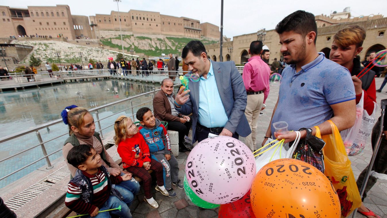 Abdullah Ghaleb Kurdi, the father of the drowned Syrian toddler Alan Kurdi whose dead body was found washed up on a Turkish beach in 2015, distributes gifts to children in Erbil