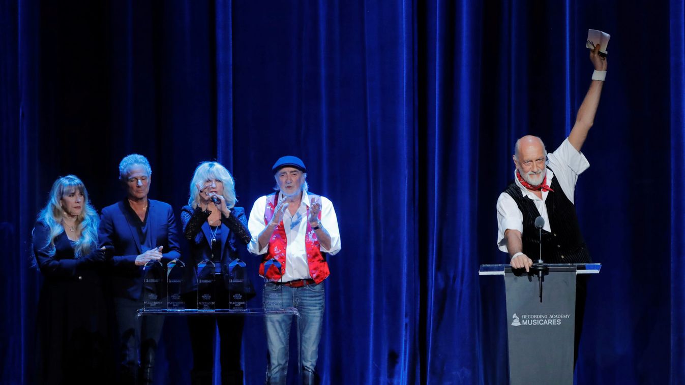 Honorees Stevie Nicks, Lindsey Buckingham, Christine McVie, and John McVie,  listen to Mick Fleetwood speak as the group Fleetwood Mac is honored during the 2018 MusiCares Person of the Year show honoring Fleetwood Mac at Radio City Music Hall in Manhatt