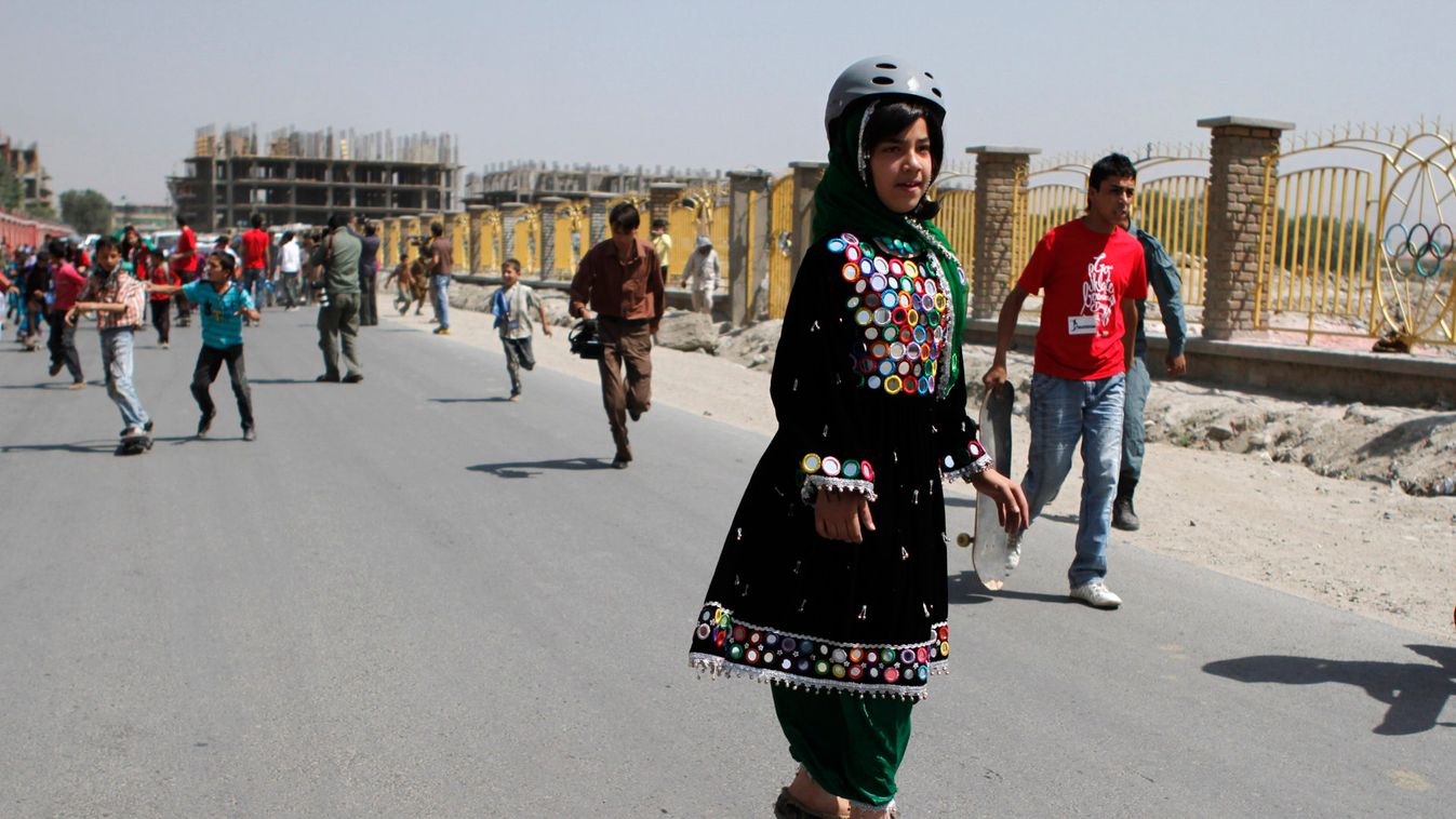 An Afghan girl takes part in a skate boarding competition to mark the third annual Go Skateboarding Day in Kabul