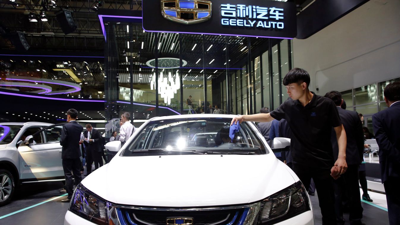 Visitors gather at Geely Auto's booth during the Auto China 2016 auto show in Beijing