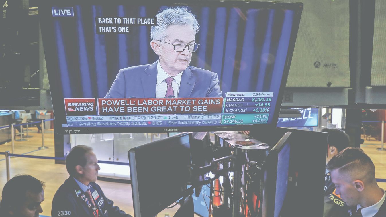 Traders work as a screen shows Federal Reserve Chairman Jerome Powell's news conference after the U.S. Federal Reserve interest rates announcement on the floor of the  NYSE in New York