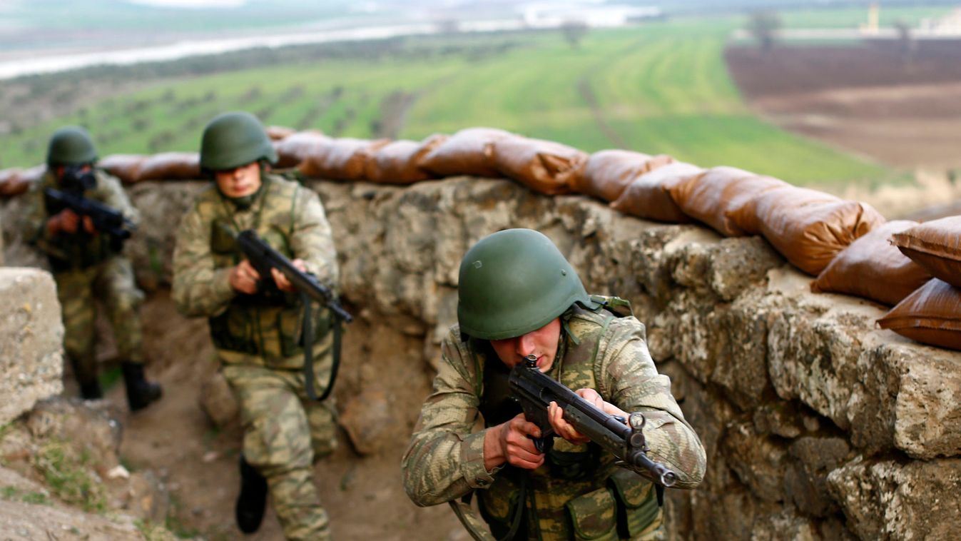 Turkish soldiers participate in an exercise on the border line between Turkey and Syria near the southeastern city of Kilis