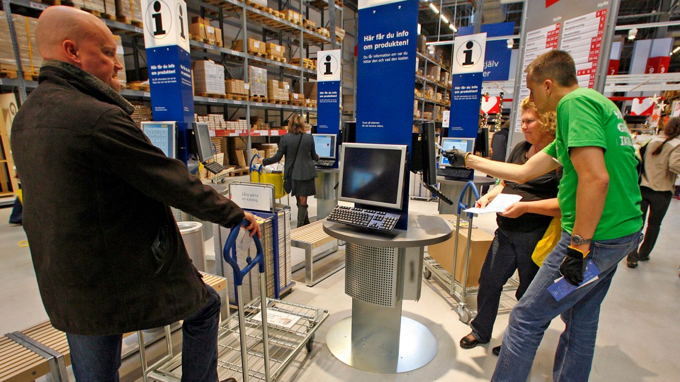 Customers check products on computer terminals at IKEA's newest store in Malmo