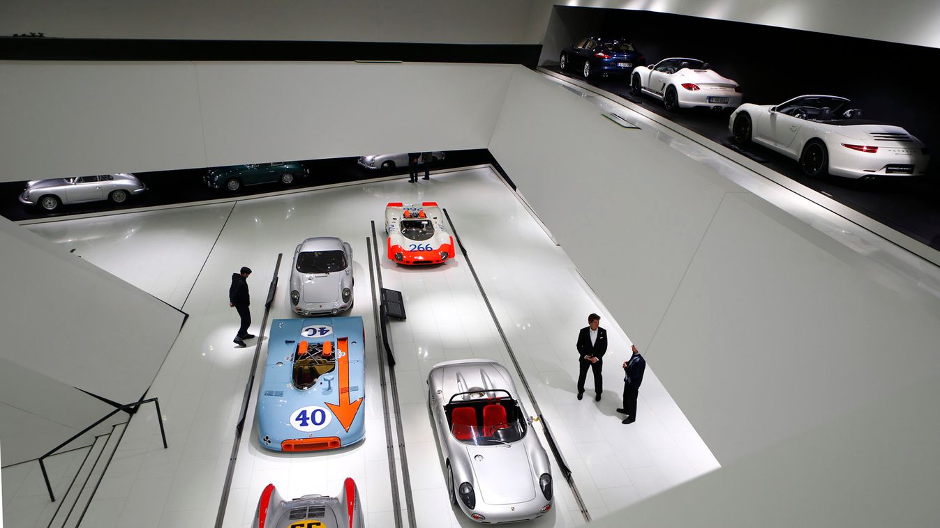 Visitors stroll through the museum of German sports car manufacturer Porsche in Stuttgart