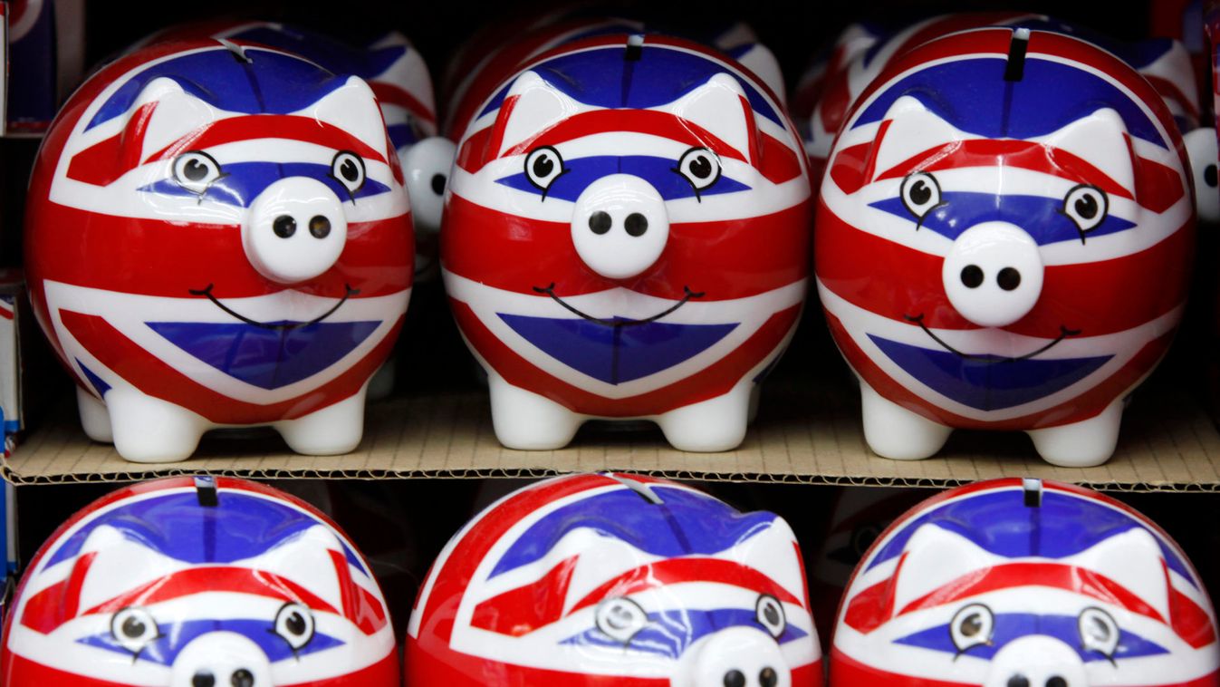 Row of piggy banks adorned with the colours of Britain's Union Jack flag are seen in a souvenir shop in London