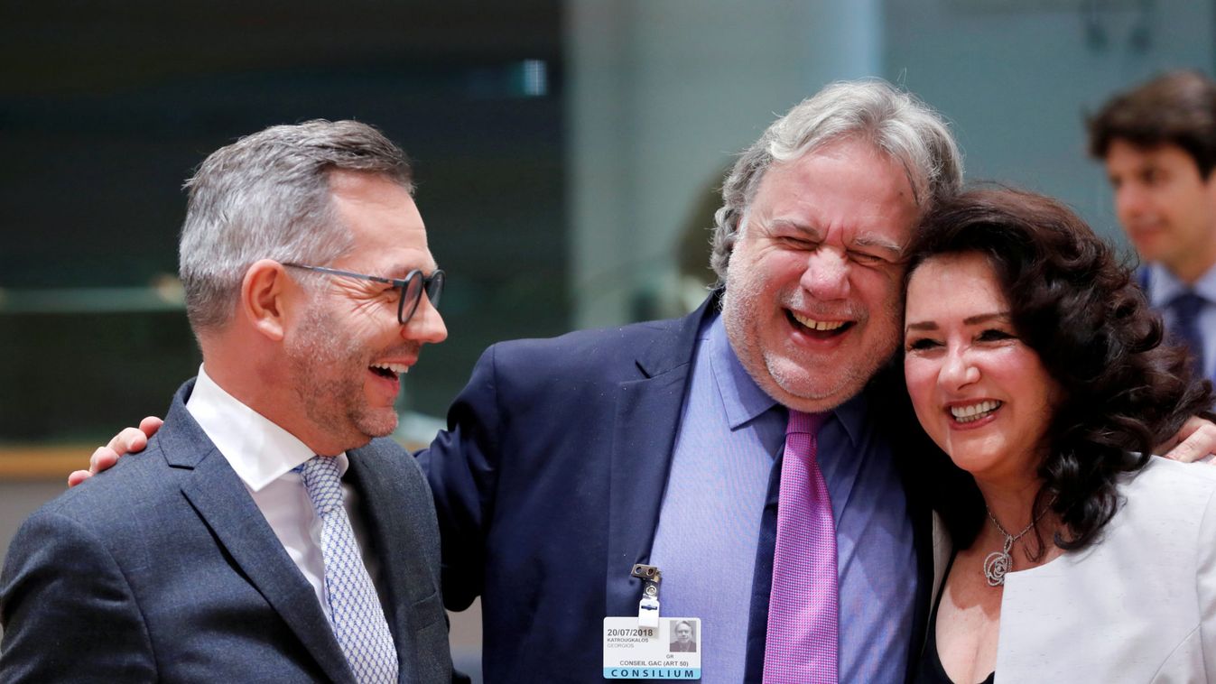 German Minister of State for Europe Michael Roth, Greek European Affairs State Secretary Georgios Katrougalos and Maltese European Affairs Minister Helena Dalli share a laugh as they attend a European Union foreign ministers meeting in Brussels