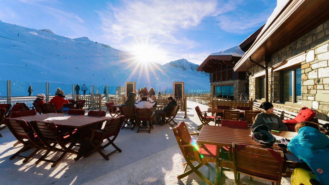People in street cafes with tables at Hintertux Glacier Austria