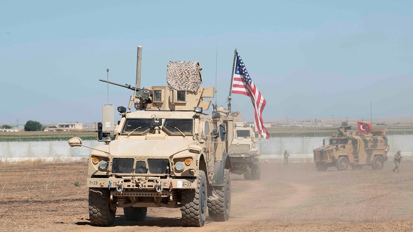 U.S. and Turkish military forces conduct a joint ground patrol in northeast Syria