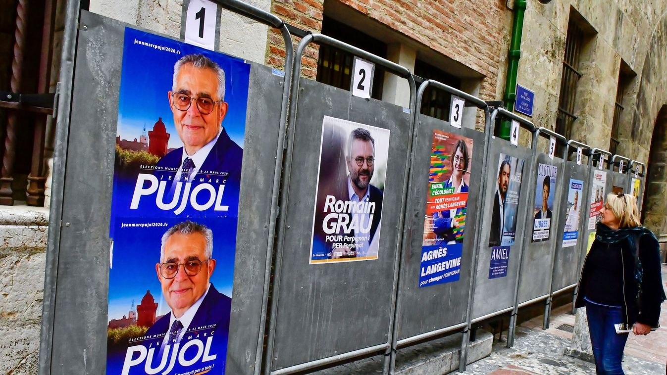 Campaign posters of Jean-Marc Pujol, Mayor of Perpignan, are seen in front of the city hall in Perpignan