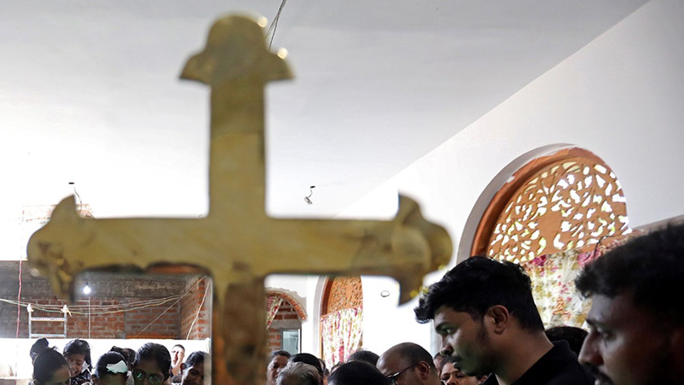 Disna Srimali, 37, the injured mother of eight-month-old Mathew, who died during a string of suicide bomb attacks on churches and luxury hotels on Easter Sunday, and family mourn at his funeral in Negombo
