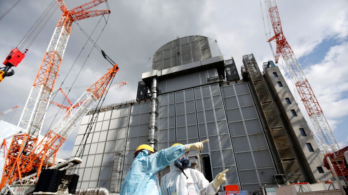 An TEPCO employee gives lectures at tsunami-crippled Fukushima Daiichi nuclear power plant in Okuma town, Fukushima prefecture