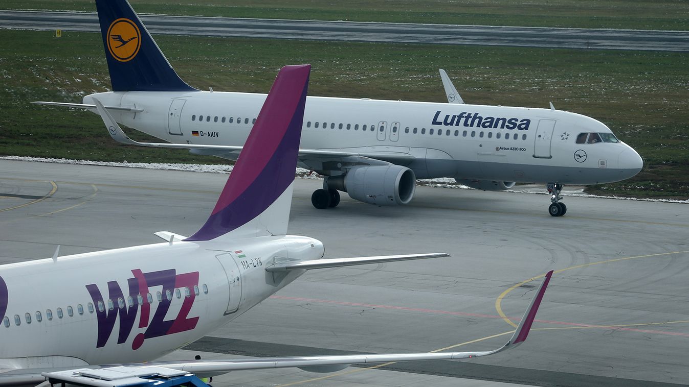 Lufthansa airplane moves past Wizzair airplane at the Sarajevo airport in Sarajevo