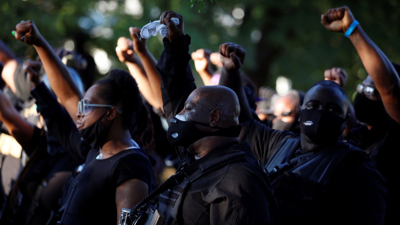Members of a Black militia group called the NFAC hold an armed rally in protest over the police killing of Breonna Taylor