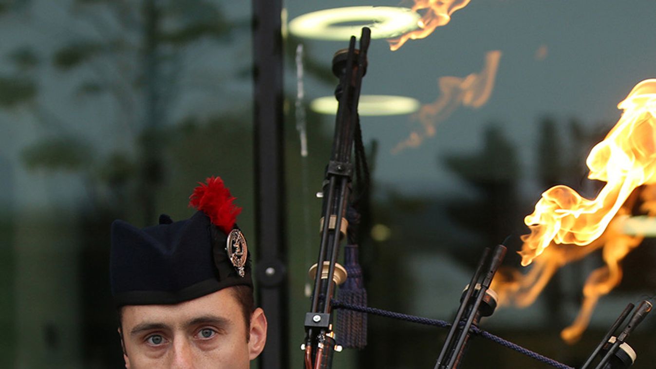 Ryan Randall plays the bagpipes outside a polling station in Edinburgh