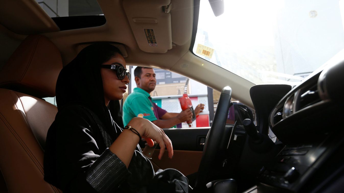 Majdooleen, who is among the first Saudi women allowed to drive in Saudi Arabia, refuels her car as she drives work in Riyadh, Saudi Arabia