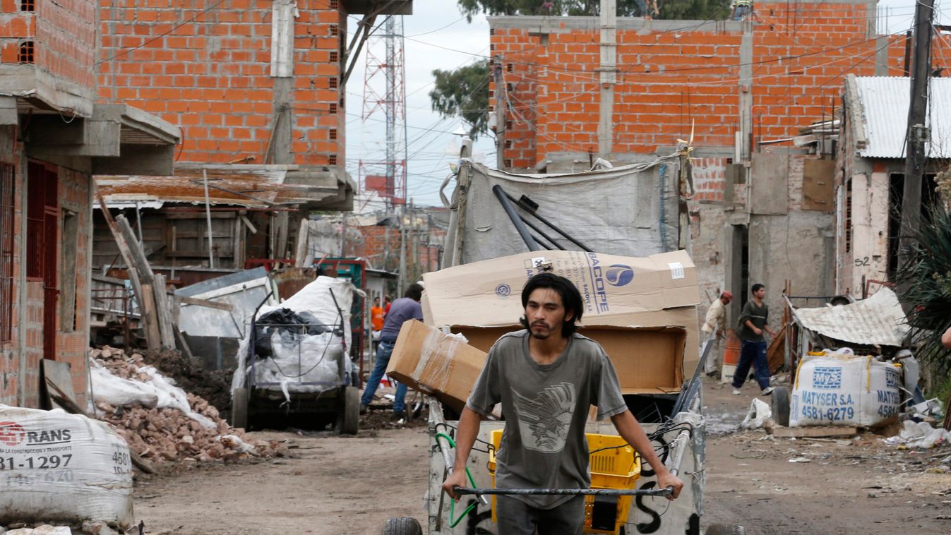 A garbage collector pulls his cart at a shantytown in Buenos Aires