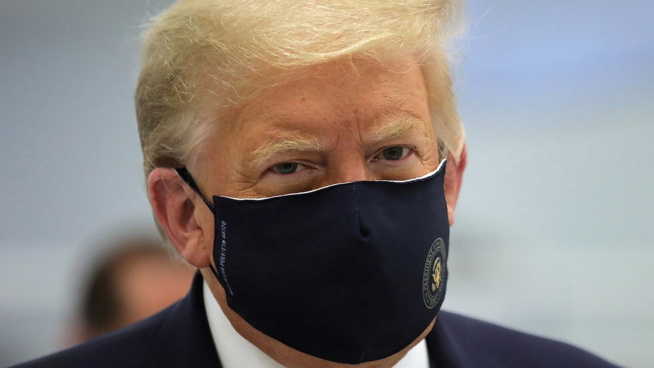 U.S. President Donald Trump wears a protective face mask during a tour of the Fujifilm Diosynth Biotechnologies' Innovation Center, in Morrisville