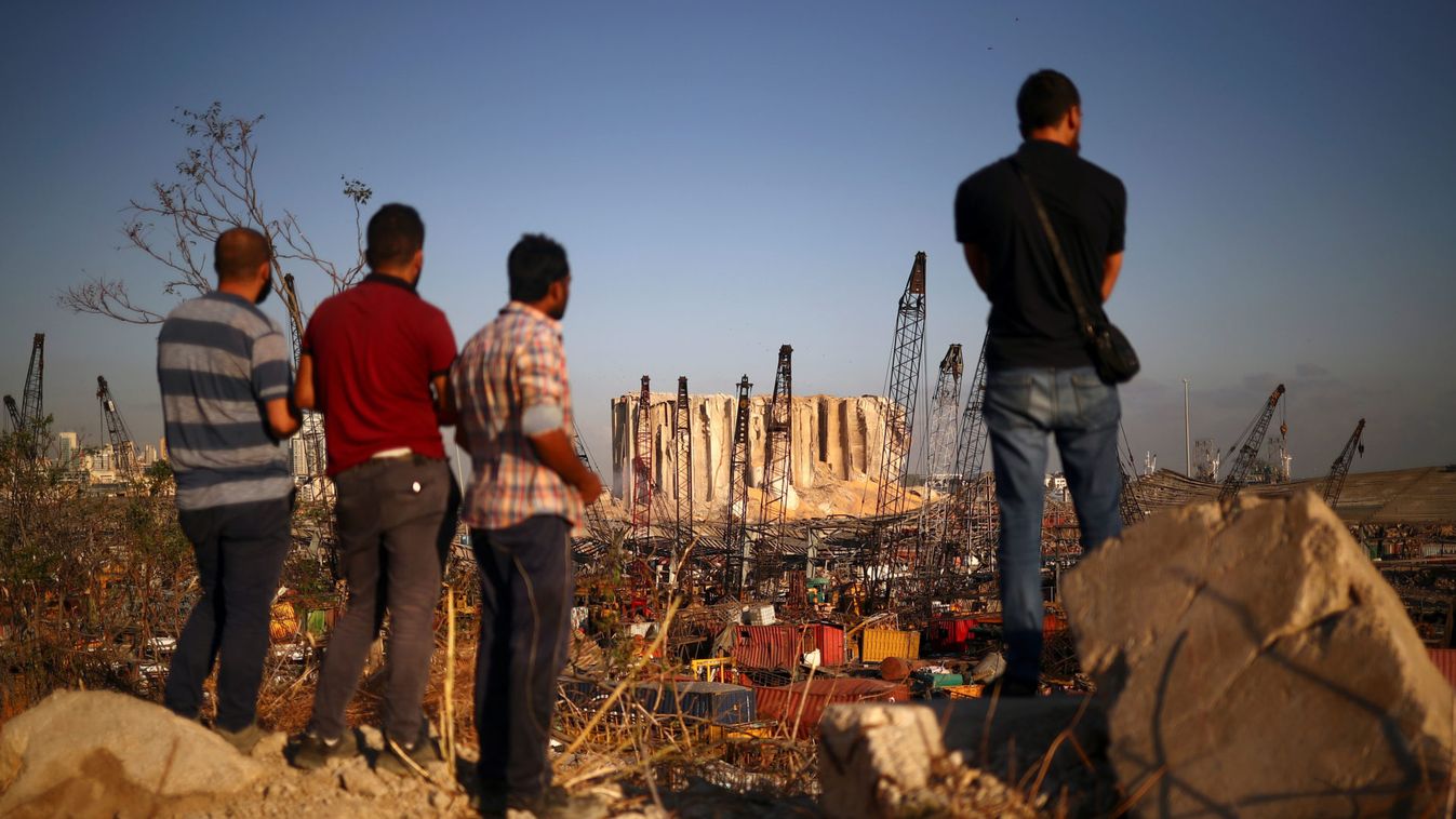 People view the damaged site of Tuesday's blast in Beirut's port area