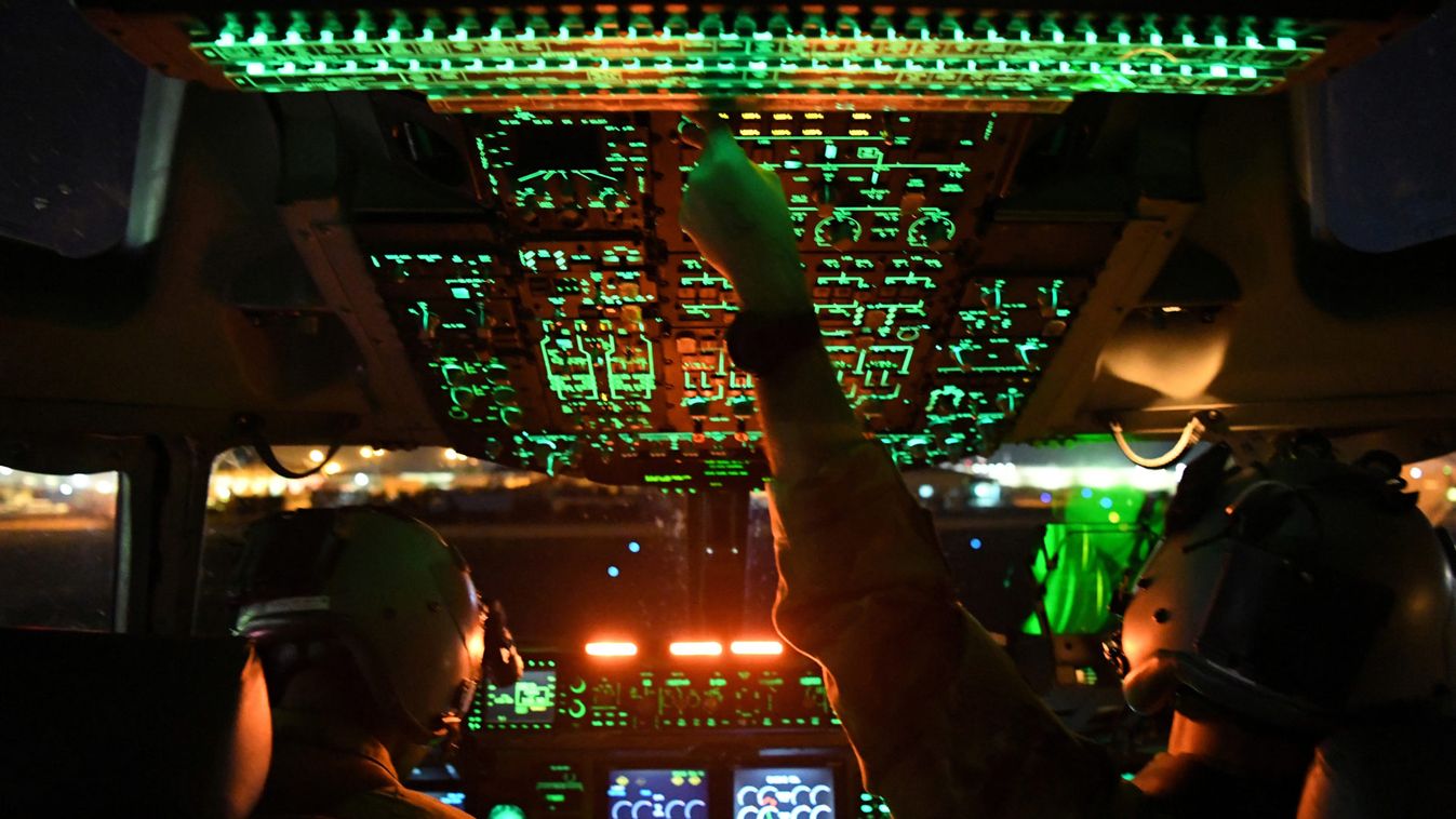 Two U.S. Air Force C-17 Globemaster III pilots assigned to the 816th Expeditionary Airlift Squadron, out of Al Udeid Air Base in Doha