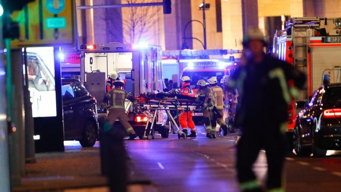 Paramedics work at the site of an accident at a Christmas market in Berlin