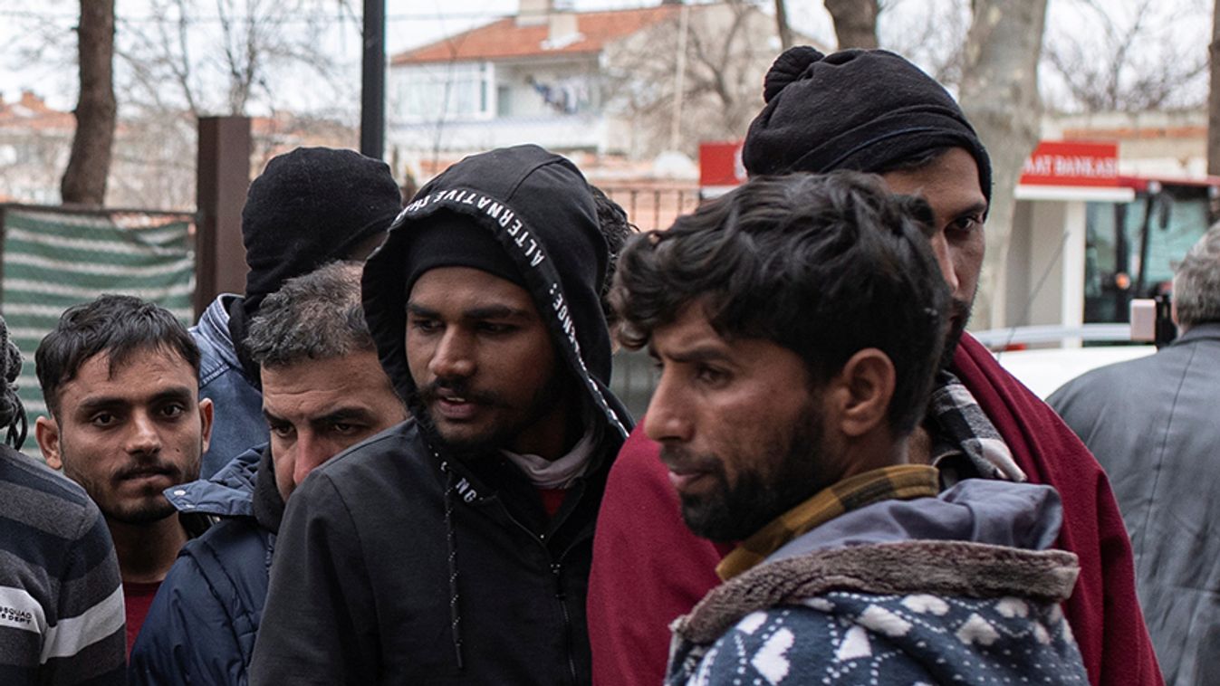 Migrants wait to enter a shop in Karaagac district near Turkey's Pazarkule border crossing with Greece's Kastanies, in Edirne