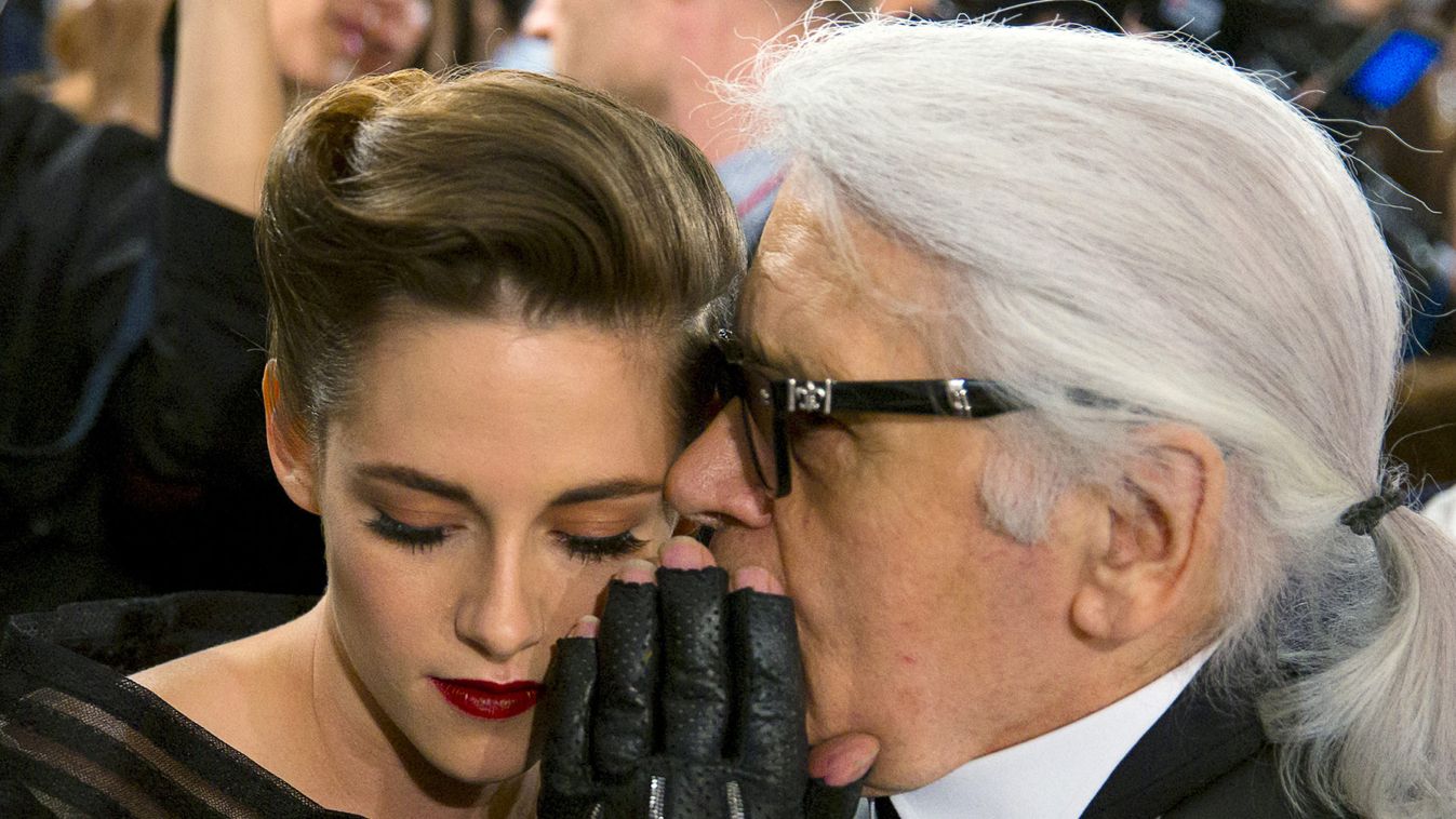 Designer Lagerfeld talks with U.S. actress Kristen Stewart after Chanel Cruise Collection 2015/16 fashion show in Seoul
