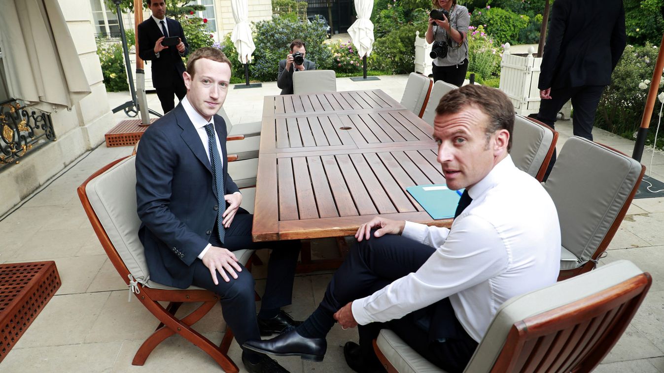 Facebook's founder and CEO Mark Zuckerberg meets with French President Emmanuel Macron at the Elysee Palace after the "Tech for Good" summit, in Paris