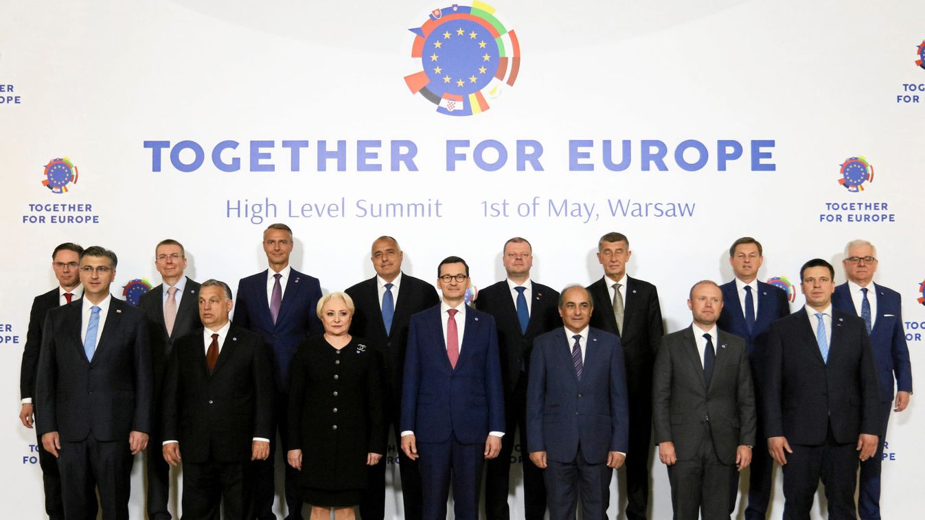 Participiants pose for family photo during 'Together for Europe', a summit for EU members that joined bloc in last 15 years at Royal Castle in Warsaw