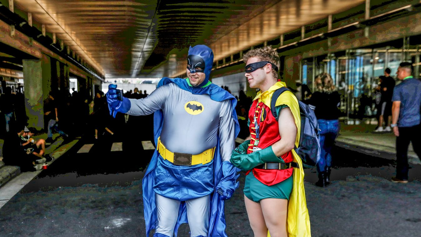 Men dressed up in costumes take a selfie as they attend the 2018 New York Comic Con in Manhattan, New York