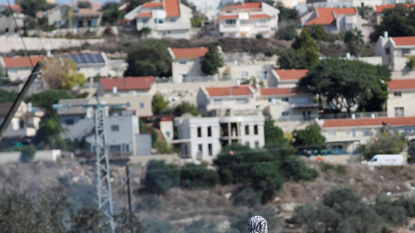 Palestinians protest against Jewish settlements in the Israeli-occupied West Bank