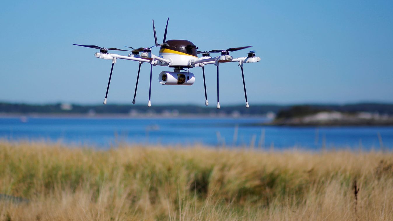 A drone, made by CyPhy Works, carries a UPS package on Children's Island off the coast of Beverly