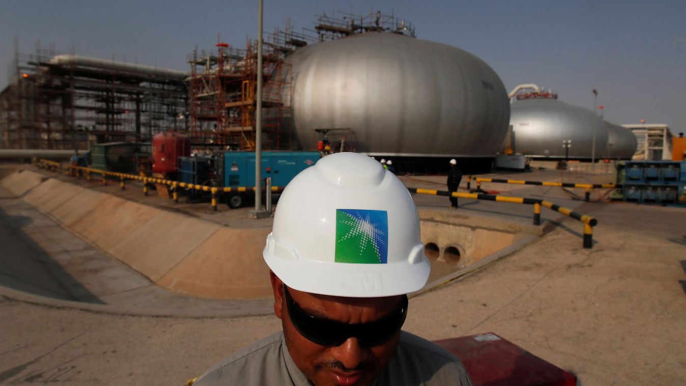 An employee in a branded helmet is pictured at Saudi Aramco oil facility in Abqaiq