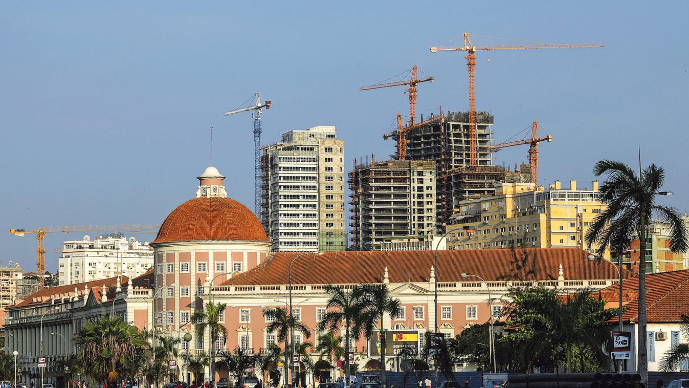 File photo of office buildings under construction standing behind the Angolan central bank building in the capital, Luanda