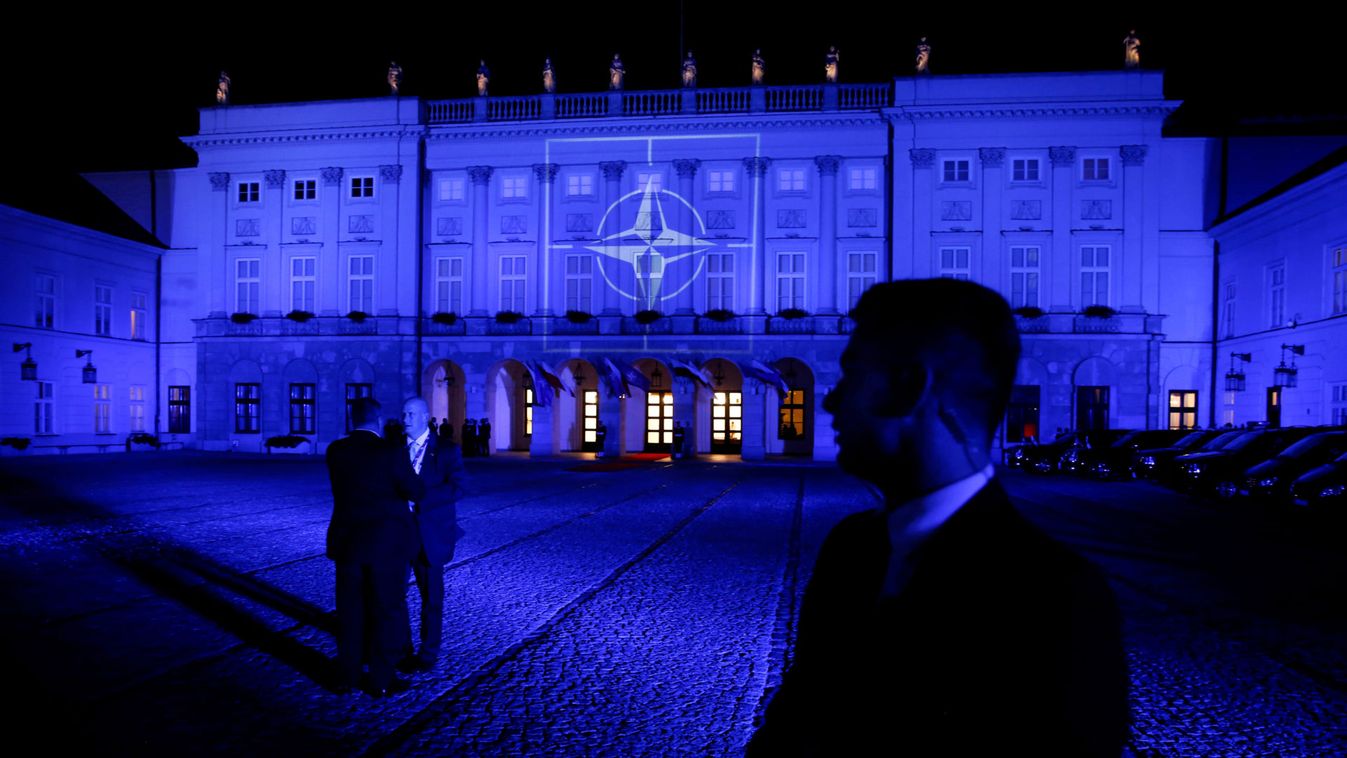 The NATO symbol is projected on the Presidential Palace in blue light as Obama and NATO leaders attend a NATO Summit working dinner in Warsaw 