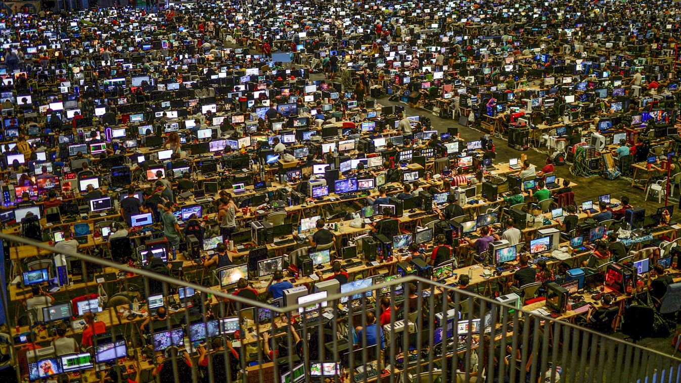 People take part in the 25th Euskal Encounter, a four-day party during which over 5,000 computers are linked via local and high speed internet connections, in the Bilbao Exhibition Centre, Barakaldo