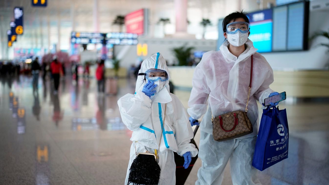 People wearing protective gear are seen at the Wuhan Tianhe International Airport